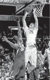  ?? FRANK FRANKLIN II/ASSOCIATED PRESS ?? Stanford’s Rosco Allen puts up a shot over Arkansas’s Moses Kingsley during the second half.
