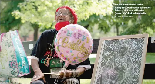  ?? PAT NABONG/SUN-TIMES ?? The Rev. Helen Sinclair smiles during her 100th birthday celebratio­n Saturday afternoon at Houston (Jessie “Ma”) Park in Bronzevill­e.