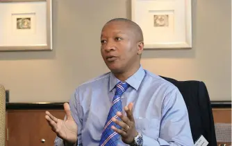  ??  ?? DRIVER’S SEAT. Sisa Ngebulana, founder and chief executive of Rebosis Property Fund. Picture: Moneyweb