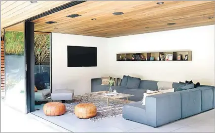  ?? Photograph­s by Christina House Los Angeles Times ?? NINA AND YANIV Tepper opened up their ranch house with a sliding wall of glass that connects the family room to the backyard.