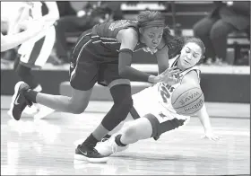  ?? NWA Democrat-Gazette/J.T. WAMPLER ?? Springdale High’s Marquesha Davis (left) steals the ball from Rogers High’s Amber Covington on Saturday during the championsh­ip game of the Panther Holiday Classic in Siloam Springs.