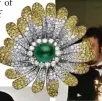  ??  ?? An emerald and diamond brooch from 1969
