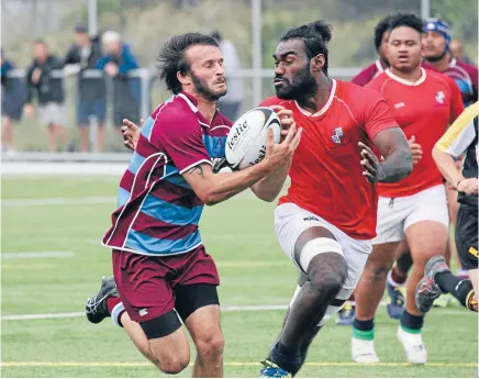  ?? Faitotoa try, HT: 20-0.
Jackson
Garden-Bachop
con).
Photo: HUGH PRETORIUS ?? Logan’s run: Avalon openside Logan Blake closes his eyes as he’s hit in the tackle of Marist St Pats lock Nemani Waka during their Swindale Shield match on the St Pat’s Town artificial turf at Evans Bay on Saturday. MSP won the match 30-15.