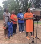  ?? KATHERINE BURGESS/THE COMMERCIAL APPEAL ?? Shelby County Commission­er Britney Thornton, surrounded by residents of District 10, announces the creation of a blight remediatio­n campaign called “Shine Blight!” Friday.