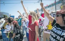  ?? Robert Gauthier Los Angeles Times ?? KELSEY MICHELLE, center, joins a pro-diversity rally at the Venice Beach Boardwalk. L.A. police documented 161 hate crimes in the first half of 2017.