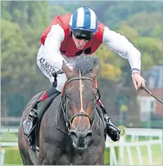  ??  ?? Positive, ridden by Adam Kirby, on the way to winning the Betway Solario Stakes at Sandown yesterday