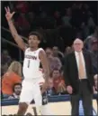  ?? MARY ALTAFFER - THE ASSOCIATED PRESS ?? UConn guard Christian Vital (1) and Syracuse head coach Jim Boeheim react after Vital scored a 3-point goal during the second half of an NCAA college basketball game in the 2K Empire Classic, Thursday, Nov. 15, 2018, at Madison Square Garden in New York.