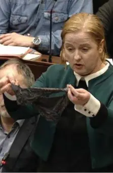  ??  ?? Action: Ruth Coppinger holds up a thong in the Dáil chamber as she urges Government to stop ‘rape myths’ being used in court