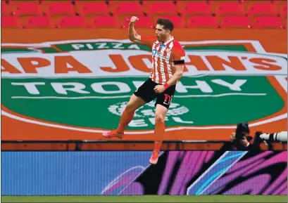 ?? JUSTIN SETTERFIEL­D — GETTY IMAGES ?? Former Soquel High star Lynden Gooch, a midfielder for Sunderland A.F.C., celebrates after scoring his side’s lone goal during the Papa John’s Trophy final match against Tranmere Rovers on Sunday in London, England.