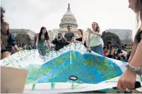  ?? TING SHEN THE NEW YORK TIMES ?? Students participat­e in a 2019 youth climate strike in Washington. A former Obama administra­tion official says the U.S. will have to take aggressive action at home to rebuild trust among its allies.