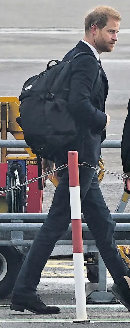  ?? ?? The Duke of Sussex, the first to leave Balmoral, boards a plane at Aberdeen airport as he travels to London after the death of Queen Elizabeth II