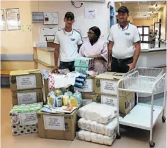  ?? Picture: SIMTEMBILE MGIDI ?? HELPING NEW MOMS: Eezi Towing employees Francois le Roux, left, and Brad Cartwright, flank Frontier Hospital sister Nomsa Vananda with the donations to moms and their babies
