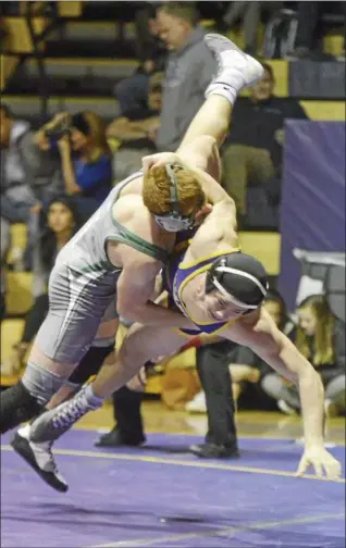  ?? STAN HUDY - SHUDY@DIGITALFIR­STMEDIA.COM ?? Shenendeho­wa’s Jake McGrail has Ballston Spa’s James Prastio up in th eair and headed to the mat during their 160-pound match Tuesday Night in a Suburban Council battle of unbeatens at Ballston Spa. McGrail won, 18-9.