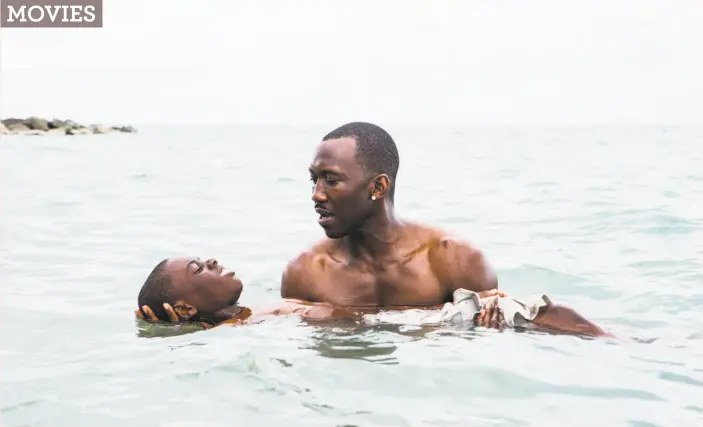  ?? David Bornfriend / A24 ?? Mahershala Ali holds Alex Hibbert as he floats in the water in “Moonlight.” Ali drew on his experience­s in the Bay Area for the role as Cuban drug dealer Juan.