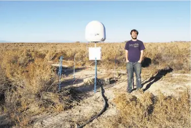  ?? Associated Press ?? Caltech astronomer Christophe­r Bochenek helped spot the burst with handmade antennas near Delta, Utah.