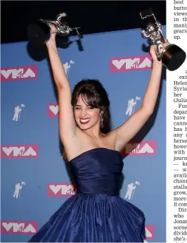  ??  ?? Cabello holds her awards for Video of the Year and Artiste of the Year in the press room at the 2018 MTV Video Music Awards last Aug 20. — AFP file photo