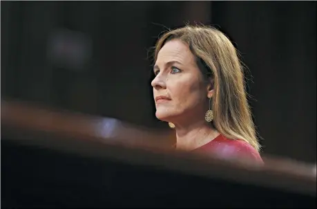  ?? STEFANI REYNOLDS/POOL VIA AP ?? Supreme Court nominee Amy Coney Barrett listens during a confirmati­on hearing before the Senate Judiciary Committee, Oct. 13, on Capitol Hill in Washington.
