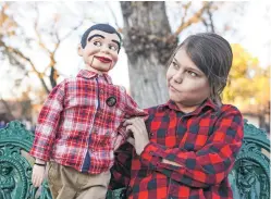  ?? GABRIELA CAMPOS/THE NEW MEXICAN ?? Ventriloqu­ist Paolo Buis, 10, sits with his dummy Charles Alexander McCarthy, entertaini­ng passersby Friday on the Plaza.