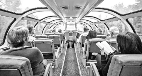  ??  ?? Views from the Skyline dome car, with windows framing the earth and the sky, can be spectacula­r. Falling asleep in one of these seats is a major faux pas.