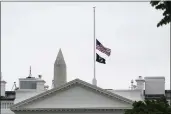  ?? SUSAN WALSH — THE ASSOCIATED PRESS ?? The American flag flies at half-staff at the White House in Washington on Thursday as the Biden administra­tion commemorat­es 1 million American COVID-19 deaths.