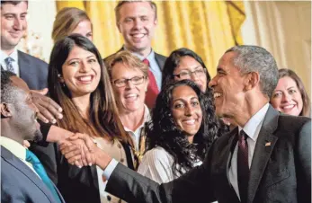  ?? ANDREW HARNIK, AP ?? President Obama greets guests during Demo Day at the White House last Tuesday. Obama noted that fewer than 1% of venture capital-backed companies have an African-American founder.