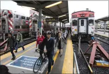  ??  ?? Caltrain riders arrive in San Francisco during the morning commute. Advocates say the region’s transit agencies must work together and put customers first.