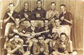  ?? Photo: Contribute­d ?? Signalman Con Robinson (bottom left, with his mouth organ band) served in Hollandia and Morotai during World War II.