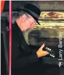  ??  ?? Doc Maclean tunes his guitar before his eShowe performanc­e at The House in Zululand