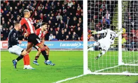  ?? Photograph: Mark Kerton/Shuttersto­ck ?? Wes Foderingha­m of Sheffield United (right) dives in vain to keep out Anis Ben Slimane’s decisive own goal.