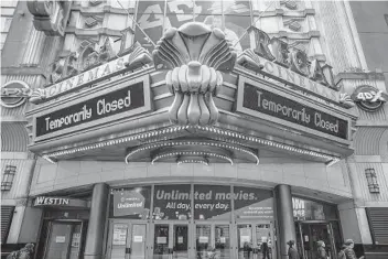  ?? VICTOR J. BLUE GETTY IMAGES ?? A closed Regal Cinemas in New York. Theaters in several of America’s largest markets remain closed.