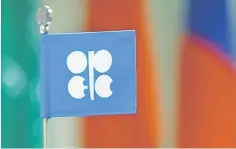  ??  ?? A flag with the OPEC logo is seen during a meeting of OPEC and non-OPEC producing countries in Vienna, Austria. Oil markets were tepid on Monday as traders were reluctant to take on big new positions ahead of an OPEC meeting at the end of the month,...