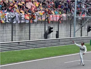  ??  ?? In this file photo taken on April 14, 2019 Mercedes’ British driver Lewis Hamilton waves to fans after winning the Formula One Chinese Grand Prix in Shanghai.