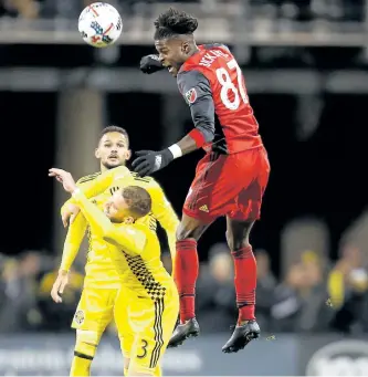  ?? KIRK IRWIN/GETTY IMAGES ?? Tosaint Ricketts, of Toronto FC, heads the ball away from Josh Williams, of the Columbus Crew SC, during the second half at MAPFRE Stadium, on Nov. 21, in Columbus, Ohio.