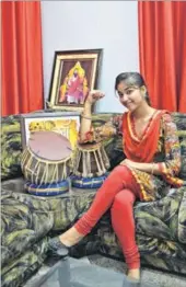  ?? HT PHOTO ?? Singer Ginni Mahi at her residence in Jalandhar.