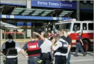  ?? JOHN MINCHILLO — THE ASSOCIATED PRESS ?? Emergency personnel and police respond to reports of an active shooter situation near Fountain Square, Thursday in downtown Cincinnati.