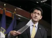  ?? MANUEL BALCE CENETA — AP PHOTO ?? House Speaker Paul Ryan holds his copy of insurance premium statistics during a news conference on Capitol Hill in Washington. Ryan urged the GOP-controlled House to pass a “critical first step toward delivering relief” from President Barack Obama’s...