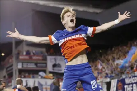  ?? JOHN MINCHILLO — THE ASSOCIATED PRESS ?? Great Valley graduate Jimmy McLaughlin, celebratin­g FC Cincinnati’s penalty shootout win over Chicago in June 2017, has establishe­d himself in Ohio, the first Cincy player to make 100 appearance­s for the club that will join MLS in 2019. Below, McLaughlin heads a ball against Columbus during a U.S. Open Cup match.