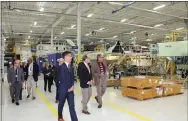  ?? MEDIANEWS GROUP FILE PHOTO ?? U.S. Sen. Pat Toomey, center, tours the final assembly area of the Sikorsky plant in Sadsbury, Chester County, in October 2019.