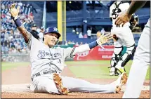  ??  ?? Milwaukee Brewers’ Orlando Arcia (3) scores the second of two runs driven in by a single to center field by Trent Grisham off Pittsburgh Pirates starting pitcher Dario Agrazal during the fourth inning of a baseball game in Pitts
burgh on Aug 5. (AP)