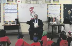  ?? PHOTO COURTESY CHRISTINE COLUNGA / ST. MARY’S SCHOOL ?? Imperial Valley Press Editor Roman Flores speaks about the importance of reading to the fourth grade class of St. Mary’s School, Thursday, March 2, in El Centro.
