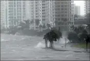 ?? WILFREDO LEE — THE ASSOCIATED PRESS ?? Waves crash over a seawall at the mouth of the Miami River from Biscayne Bay, Fla., as Hurricane Irma passes by in Miami.