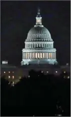  ?? MARK WILSON/GETTY IMAGES NORTH AMERICA/AFP ?? Lights shine at the US Capitol in the early hours of February 9 in Washington, DC.