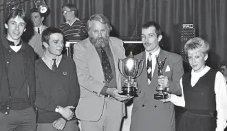  ??  ?? The Oxford alliance of scooter clubs receiving the Southend Trophy from Mike Karslake for winning the best supporting club championsh­ip. The person holding the trophies i s none other than Scootering’s very own Mark Sargeant!