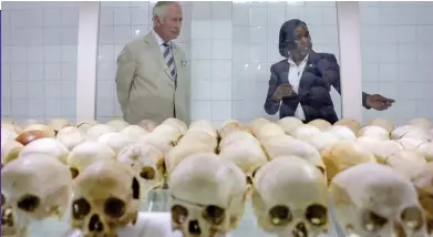  ?? ?? Distressed: Prince Charles views skulls of genocide victims in Rwanda yesterday