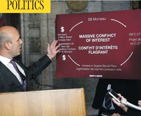  ?? SEAN KILPATRICK/THE CANADIAN PRESS ?? NDP Parliament­ary Leader Guy Caron and MP Nathan Cullen, holding sign at right, take part in a House of Commons press conference on Oct. 17, criticizin­g Liberal Finance Minister Bill Morneau for his use of conflict-of-interest screens instead of a...
