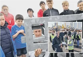  ??  ?? Lisa Wilson-Riddell with youngsters at The Box Youth Project after their van was stolen and, inset, Nathan Haley, front left, apprentice at Liebherr presents a cheque for £834 to Bradley Ford Stubbs from Project.