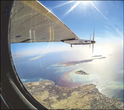  ??  ?? A handout picture made available by Solar Impulse last Tuesday, and shot by Swiss pilot Bertrand Piccard, shows Solar Impulse 2 during its flight over the Red Sea Sunday in the last leg of the round-the-world journey as it heads to Abu Dhabi, UAE. The...