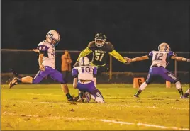  ?? PHOTO BY MIKE RUDY ?? Lackey’s Brett Culhane prepares to kick a 24-yard field goal in the second quarter of the Chargers’ game at Patuxent on Friday night. The kick was good and accounted for the game’s only points in Lackey’s 3-0 win.