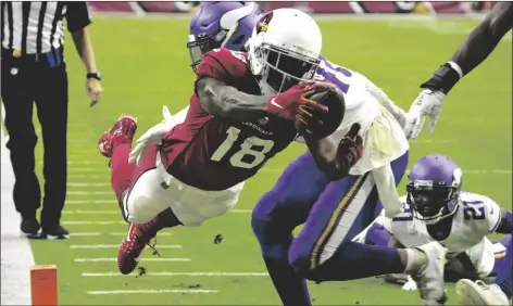  ?? RICK SCUTERI/AP ?? ARIZONA CARDINALS WIDE RECEIVER A.J. GREEN 18) dives into the end zone for a touchdown against the Minnesota Vikings during the second half of a game Sunday in Glendale.
