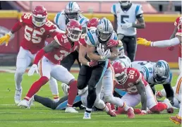  ?? Orlin Wagner, The Associated Press ?? Panthers running back Christian McCaffrey is pursued by Chiefs defenders during the first half Sunday in Kansas City, Mo.